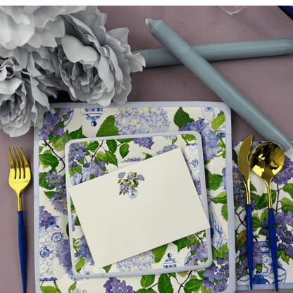 Hydrangeas and Porcelain Blank Correspondence Cards - 20 Per Package: A place setting displaying floral-themed stationery with a card and silverware, perfect for elegant handwritten notes.