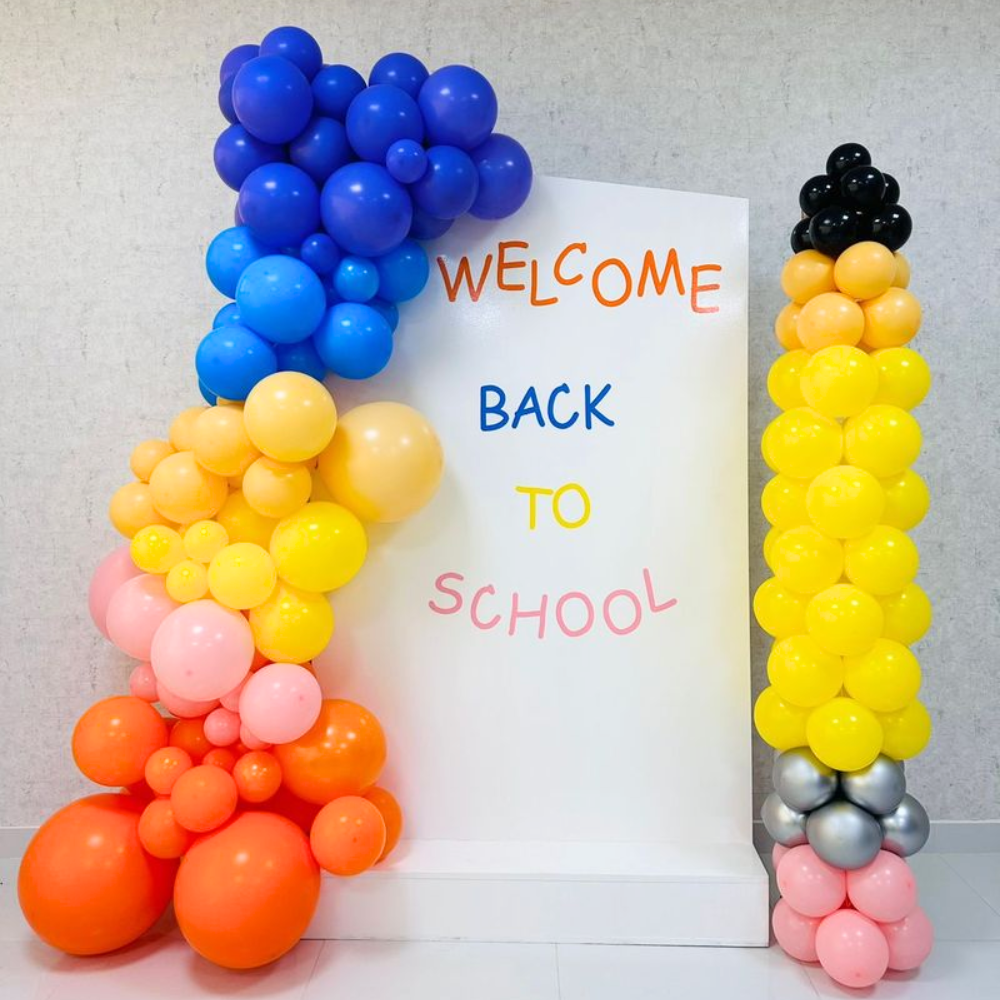 Angled Wall with Pencil Pillar Balloon Backdrop for a Back to School event display, featuring a creative arrangement of balloons.