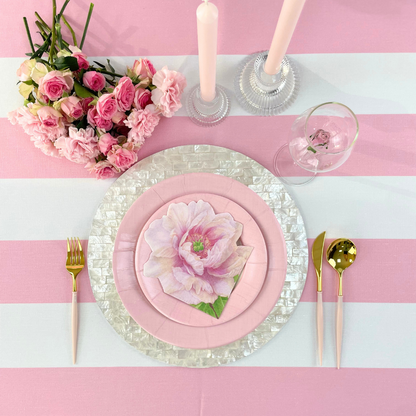 Ruffles Glass Candle Holder displayed on a pink and white striped tablecloth with floral decorations and tableware, ideal for elegant party setups.