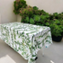 Gardenia Linen Tablecloth (1pc) displayed on a table with green plants, perfect for elevating any event with a premium look and easy maintenance.