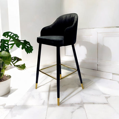 VELVET STOOL BLACK: Modern velvet stool with sleek black and gold legs, ideal for events and parties, enhancing any setting with its elegant design.