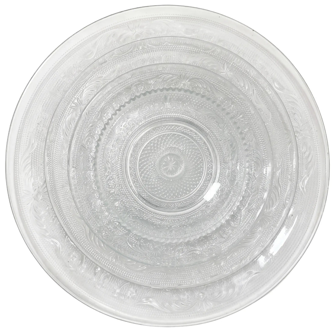 Vintage Clear Collection featuring nested etched glass plates in three sizes, ideal for elegant table settings at parties or events.