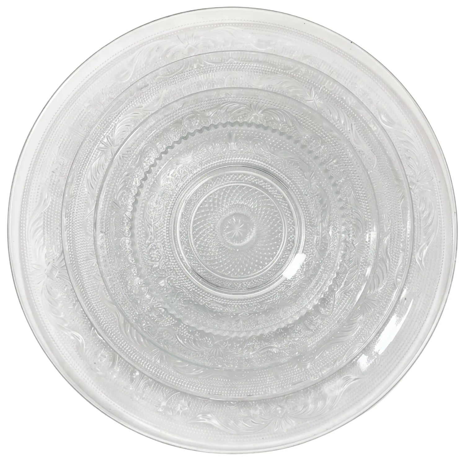 Vintage Clear Collection featuring nested etched glass plates in three sizes, ideal for elegant table settings at parties or events.