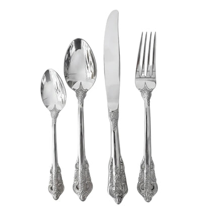 Vintage Silver Cutlery Collection: A set of four ornate silver-plated flatware pieces with scroll and floral patterns, including a teaspoon, tablespoon, dinner knife, and fork.
