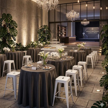 White Metal Bar Stool at a cocktail gala setup, featuring high-top tables with floral arrangements, showcasing Party Social&