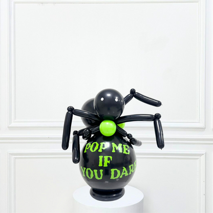 Black Spider Balloon Stack featuring a black balloon spider with green and yellow text, perfect for Halloween parties as a floor-standing or table decoration.