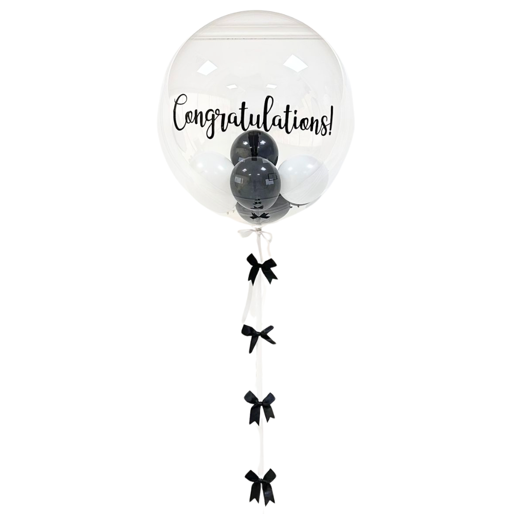 Bubble Filled Helium Giant Balloon with black and white balloons inside, featuring a handmade ribbon tail, perfect for enhancing any celebration or party atmosphere.