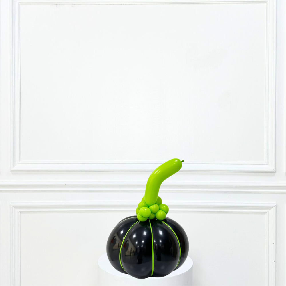 Black balloon sculpture shaped like a pumpkin, ideal for party decorations or gifts, part of Party Social&