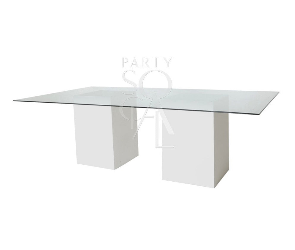 Glass dining table with a clear top and white wooden bases, suitable for corporate events and home functions, offered by Party Social events company.