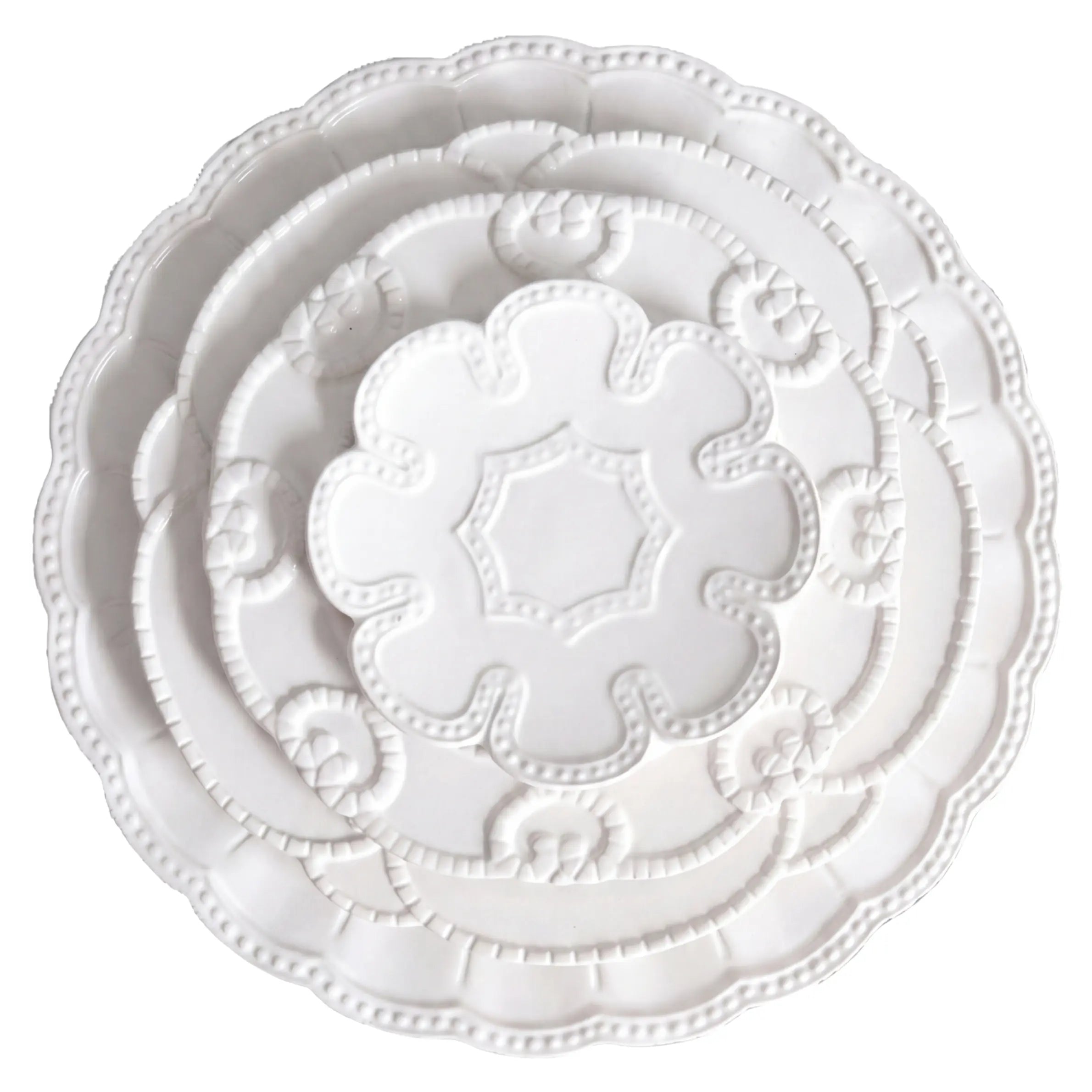 White Embossed Collection: Stack of three decorative plates, featuring scalloped edges and floral patterns, ideal for elegant event settings from Party Social.