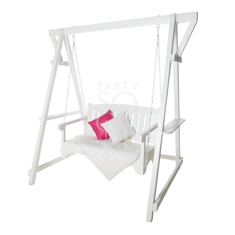 White Wooden Swing with pink pillows, suitable for event props, available at Party Social. Dimensions: 145cm L x 185cm W x 210cm H.