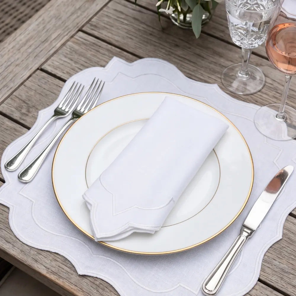 White Scalloped Linen Napkins - Set of 4, featuring elegant scalloped edges with silver embroidery, ideal for sophisticated dining and special occasions.