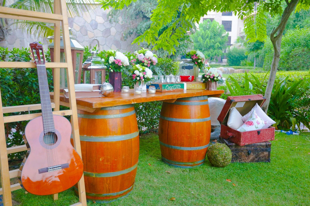 Rustic Wine Barrel Table 225ltr displayed with a wooden top and metal bands, ideal for creating unique cocktail or bar areas at events.