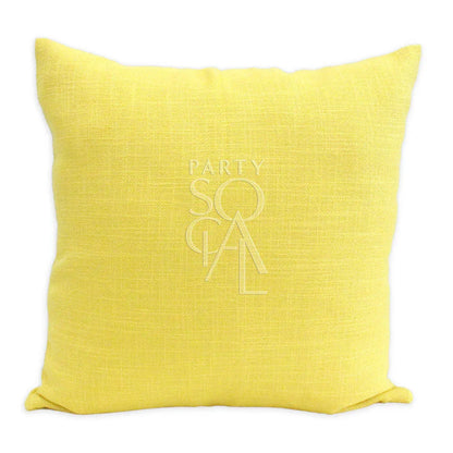 CUSHION COVER LINEN WEAVE: Yellow pillow with a logo, crafted from premium linen weave fabric, ideal for enhancing event decor with style and comfort.