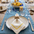 Yellow Lined Pure Linen Dinner Napkin - Set of 4, featuring white linen with elegant gold-tone borders, ideal for enhancing sophisticated table settings at any event.
