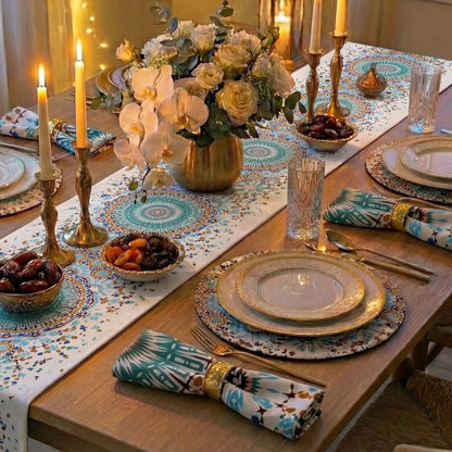 Arabesque Polyester Linen Placemats elegantly complement a formal dining setup with gold accents and floral centerpiece, enhancing the luxurious table arrangement for special occasions.