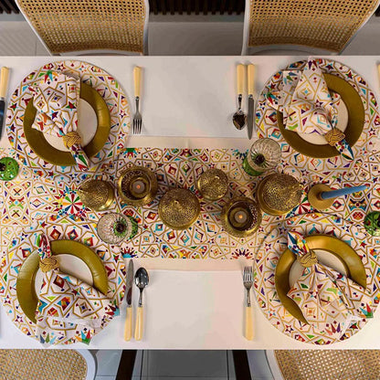 Dining table showcasing Arabesque Polyester Linen Napkin set, featuring vibrant geometric patterns, gold accents, and matching decor, ideal for elegant dinner parties or cultural gatherings.