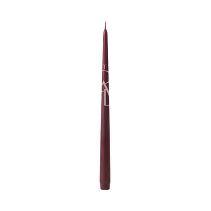 A single slim makeup stick, likely a lip liner or eyeliner pencil, in a deep burgundy shade with a white geometric logo, shown vertically against a plain white background.
