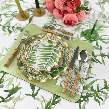 Fern &amp; Foliage Paper Appetizer &amp; Dessert Bowl-8 Per Package displayed on a table with elegant silverware. Perfect for adding style to events. From Party Social, your go-to for party essentials.