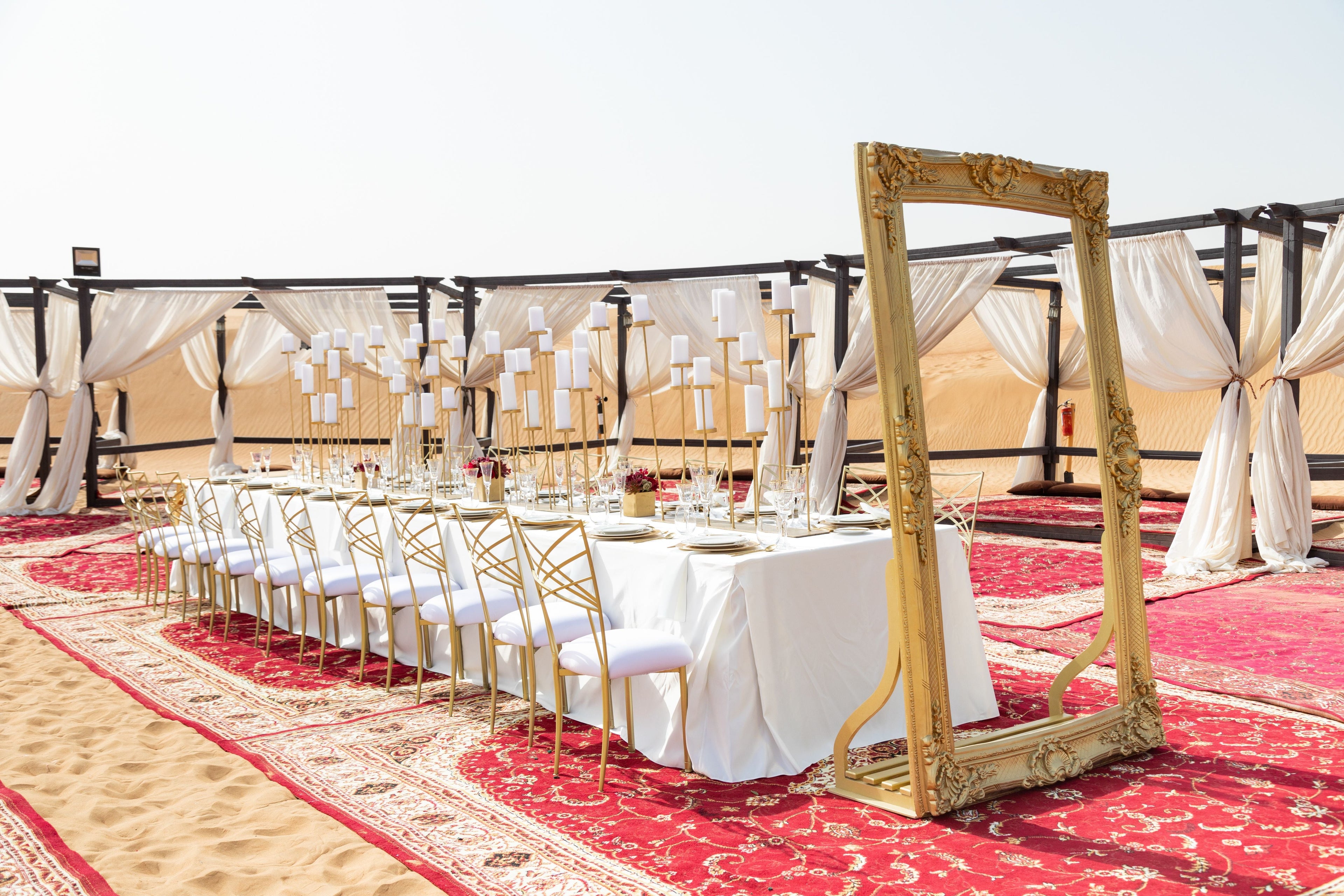 FRAME GOLD: A gold vintage frame stands elegantly on a table set for a dinner party, showcasing its versatile charm for various events.