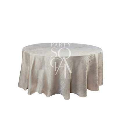 ROUND TABLECLOTH JACQUARD: A premium jacquard tablecloth draped over a round table, ideal for enhancing special occasions with elegance and style.