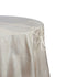 Round Jacquard tablecloth on a table, showcasing fine fabric texture, ideal for enhancing special occasions. Perfect for event settings, highlighting elegance and style.