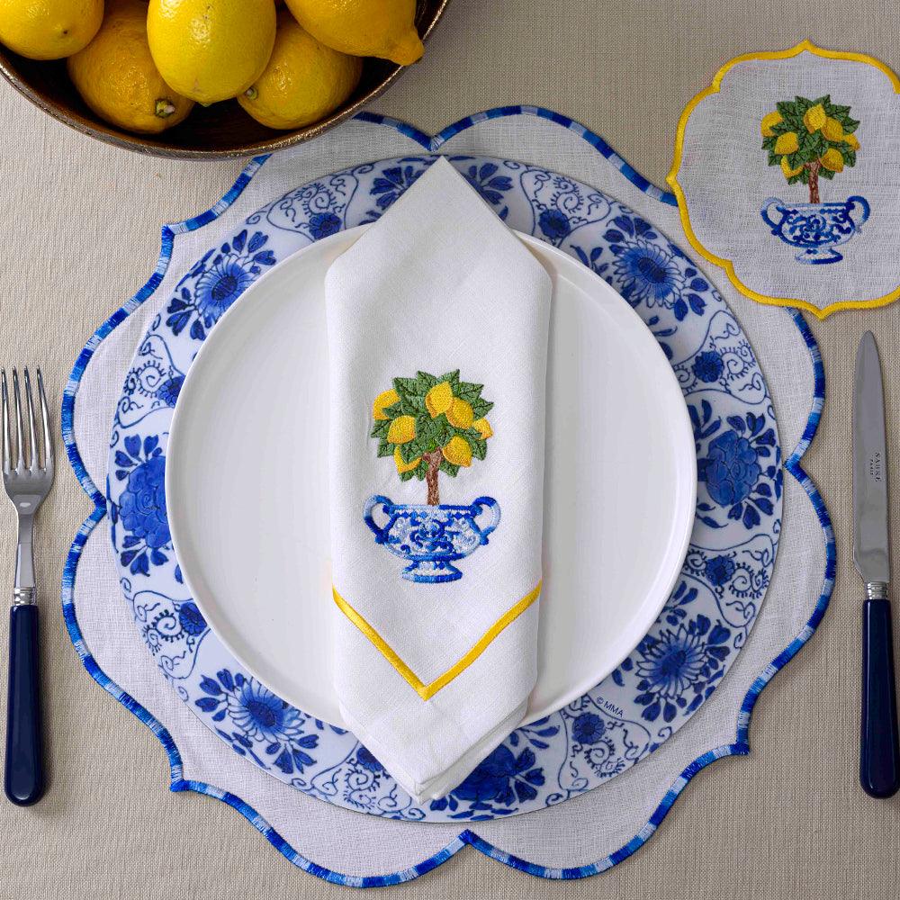 Lemoncello Pure Linen Dinner Napkin with lemons and kitchen utensils.