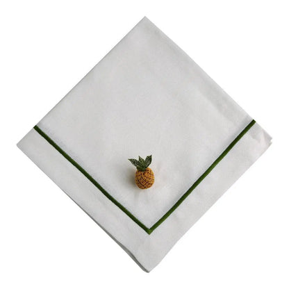 Green Lined Pure Linen Dinner Napkin - Set of 4 with green stitched border, topped by a small decorative pineapple ornament, ideal for elegant dining settings.