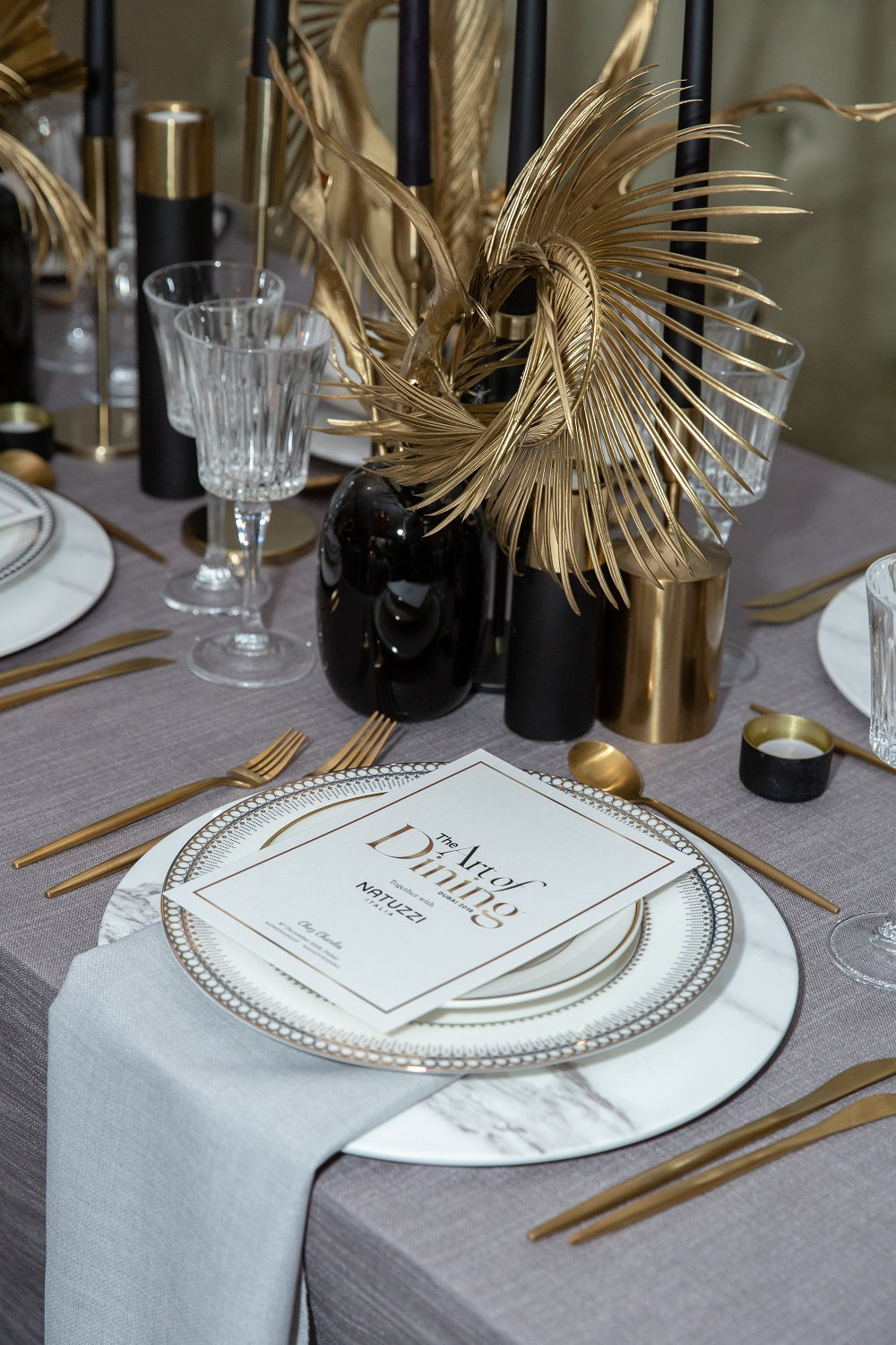 Charger Plate - Marble Tray displayed on a table with elegant tableware, including gold cutlery and a decorative vase, ideal for sophisticated event settings.