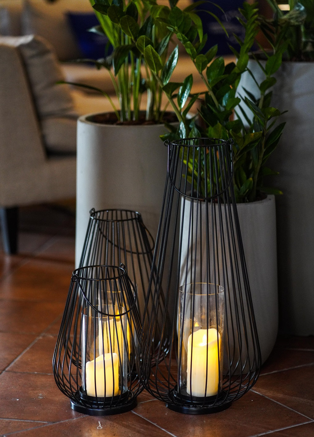 Black Wire Lanterns in metal baskets, displayed in various sizes, designed for indoor party decor. Candles not included.