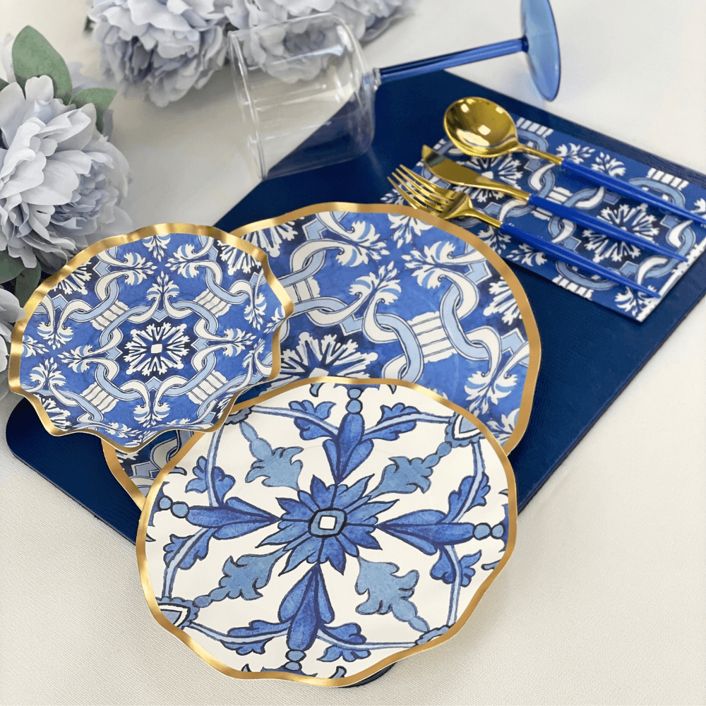 A set of Moroccan Nights Paper Dinner Plates, featuring metallic gold ruffled edges on blue & white ceramic. Perfect for adding elegance to events.