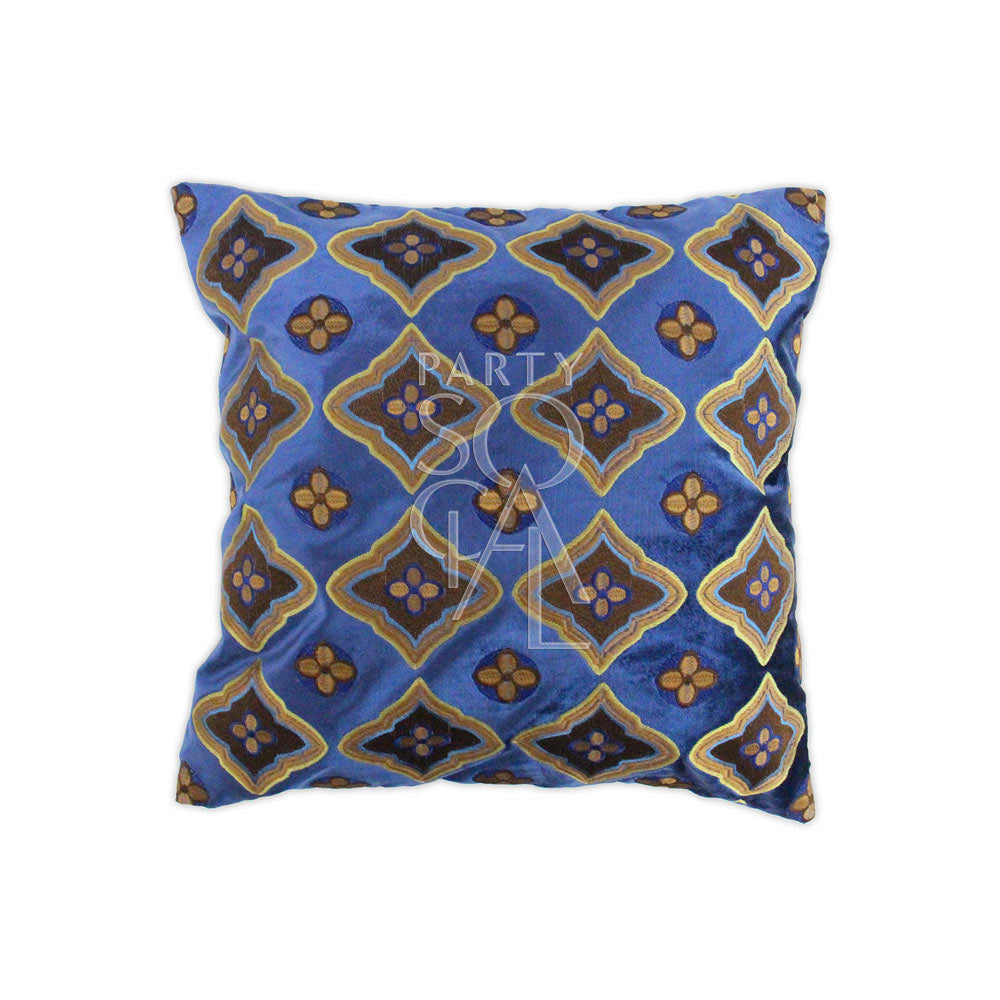 CUSHION PATTERNED BLUE &amp; EARTH TONES: Blue pillow with gold and brown design, crafted in premium velvet, ideal for enhancing event decor with elegance.