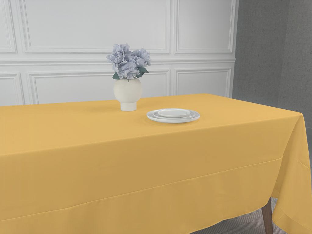 A Polycotton Tablecloth with a vase of flowers as a centerpiece. Perfect for any event or occasion.