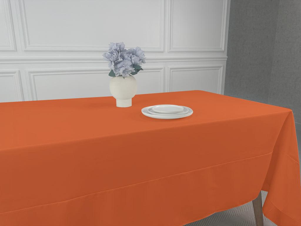 A Polycotton Tablecloth with a vase of flowers and a plate on a table