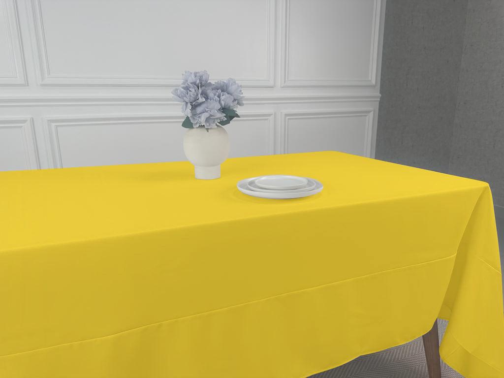 A simple, lightweight Polycotton Tablecloth with a vase of flowers and a white plate on it. Perfect for any event or occasion.