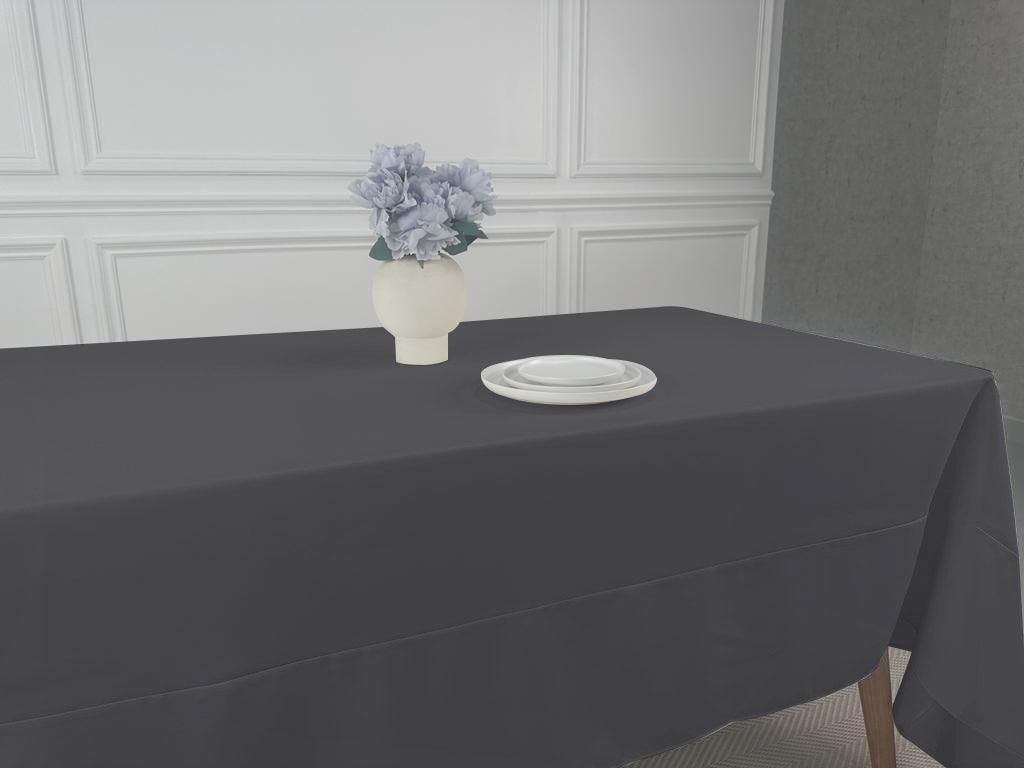 A simple, lightweight tablecloth with a vase of flowers on it. Perfect for any event or occasion. Available in various colors and sizes.