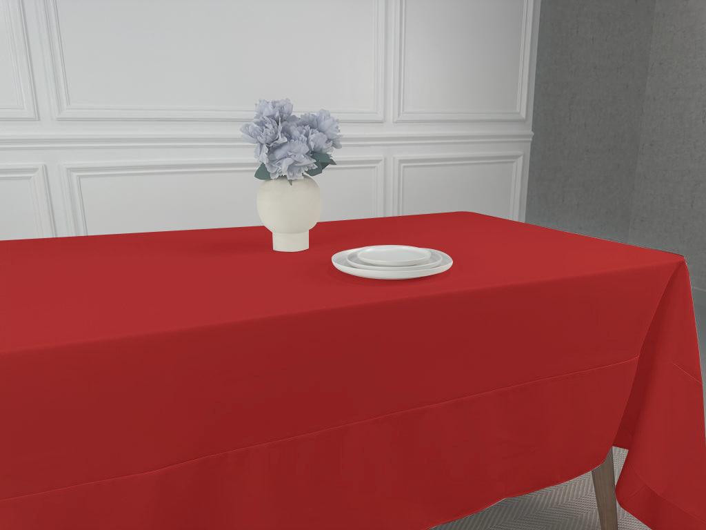 A simple, lightweight tablecloth with a white plate and vase of flowers. Perfect for any table setting.
