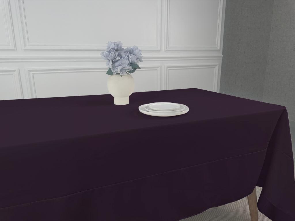 A Polycotton Tablecloth with a vase of flowers as a centerpiece. Perfect for any event or occasion. Easy to wash and reuse. Available in 3 sizes.