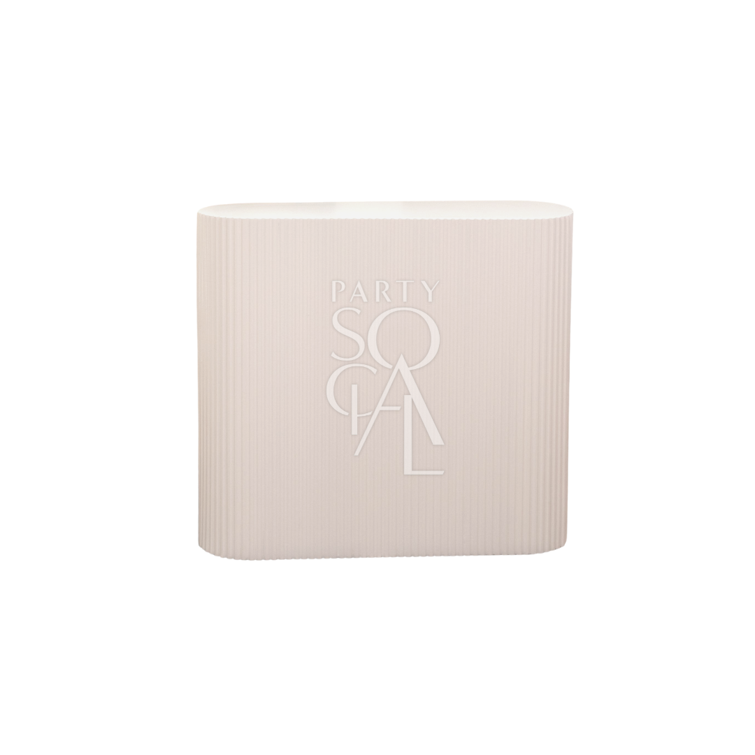 Rippled White Counter Podium with text detail, designed to enhance any event setting, available for rental or purchase from Party Social.