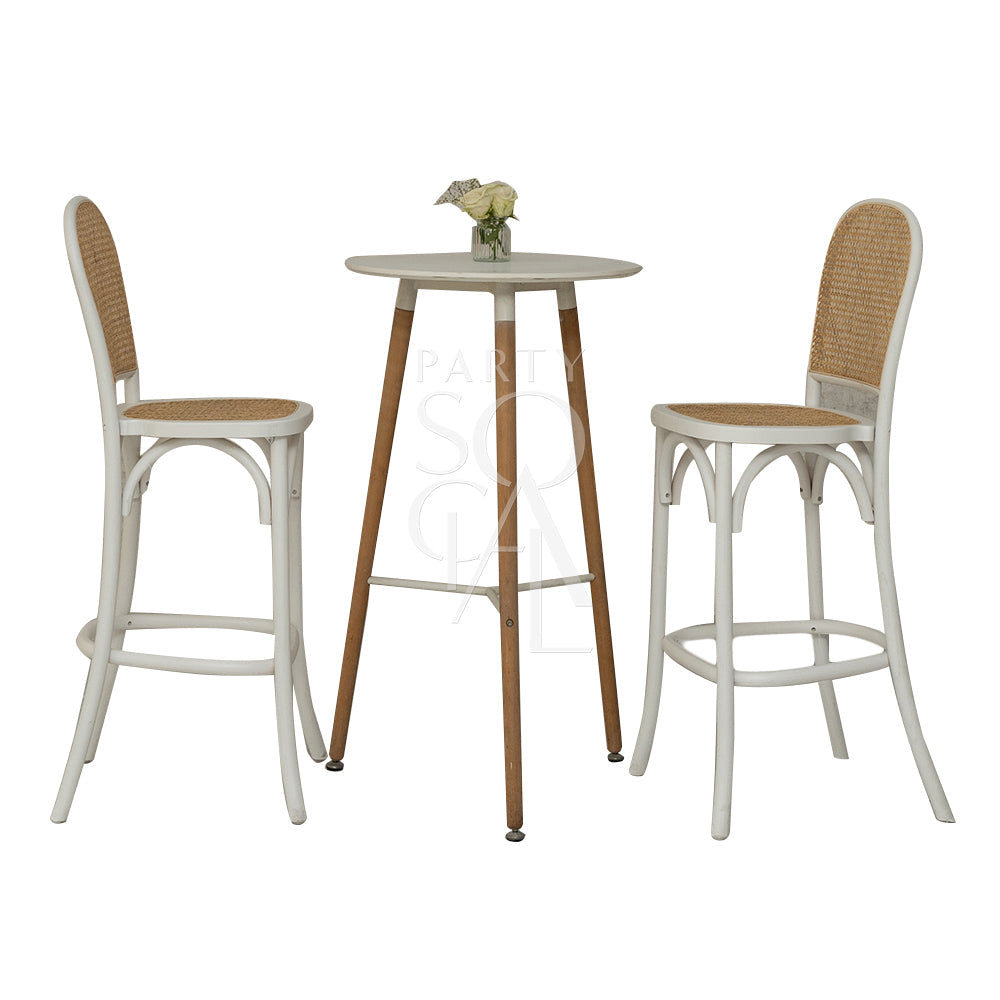 Wood Rattan Stool beside a table with a vase of flowers, ideal for weddings and events. Perfect for adding vintage charm to any setting.