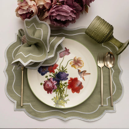 Sage Green Scalloped Linen Placemats - Set of 4, elegantly styled with matching napkin, floral china plate, gold cutlery, and a green goblet, perfect for refined table settings.
