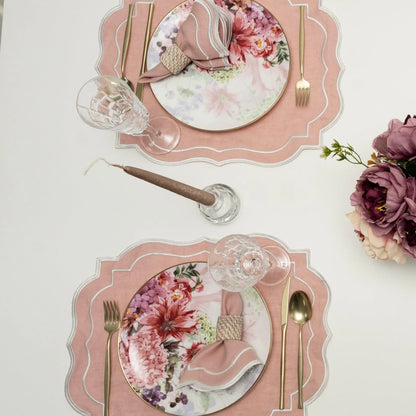 Blush Pink Scalloped Linen Placemats - Set of 4 elegantly styled with floral china, gold-tone flatware, and crystal glass, perfect for refined dining occasions.