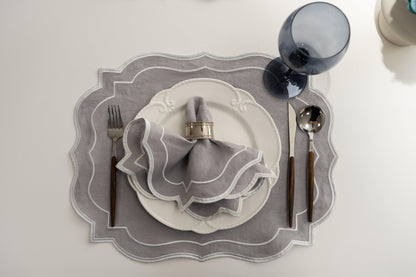Scalloped Linen Placemats with silverware and napkin on a plate