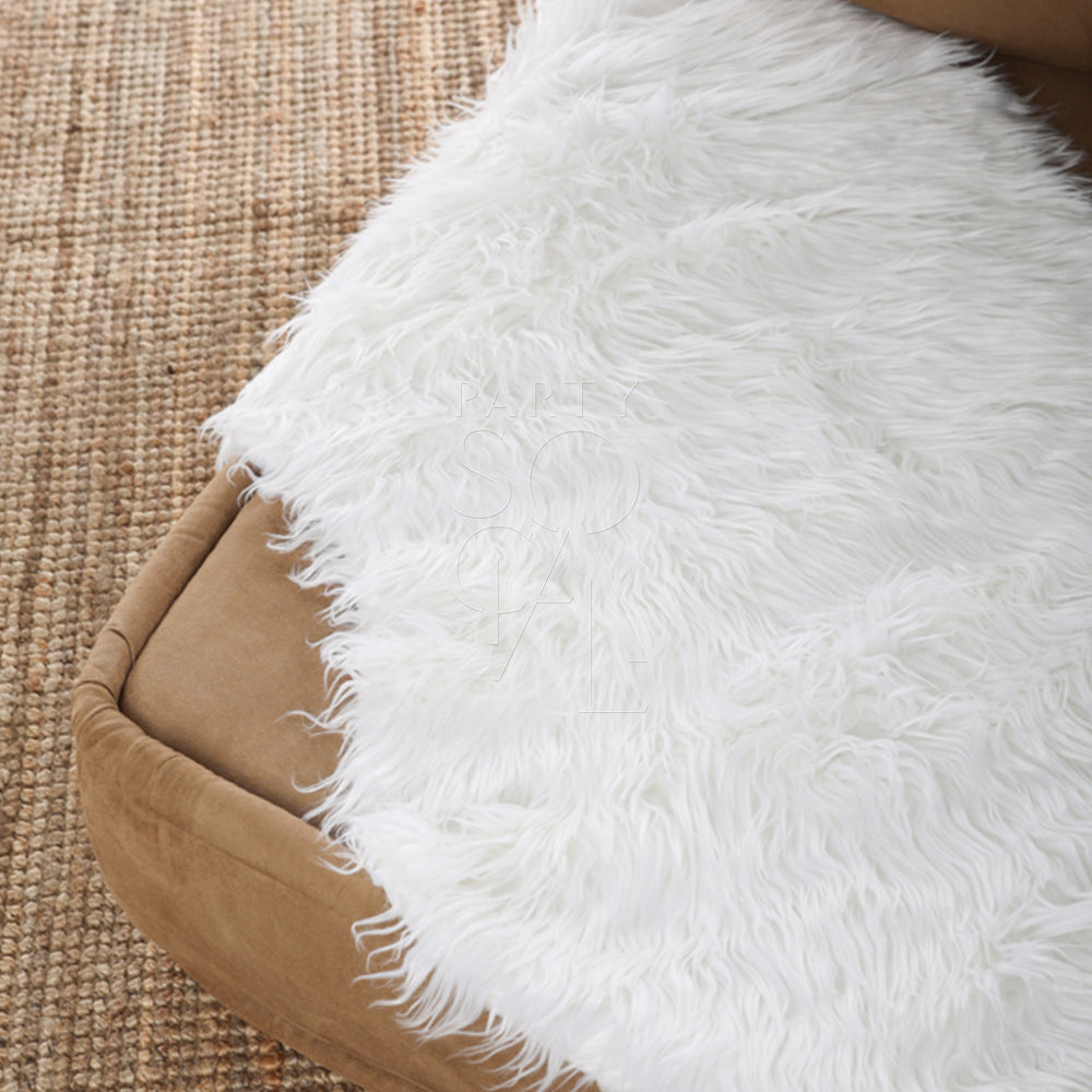 Sheepskin Curved displayed on a brown cushion, ideal for decor or event props, measures 110cm by 70cm.