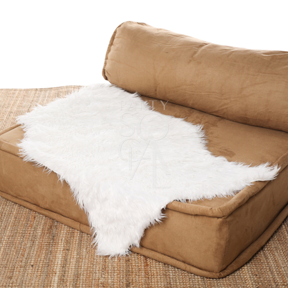 Sheepskin Curved displayed on a brown couch, ideal for event decor or props.