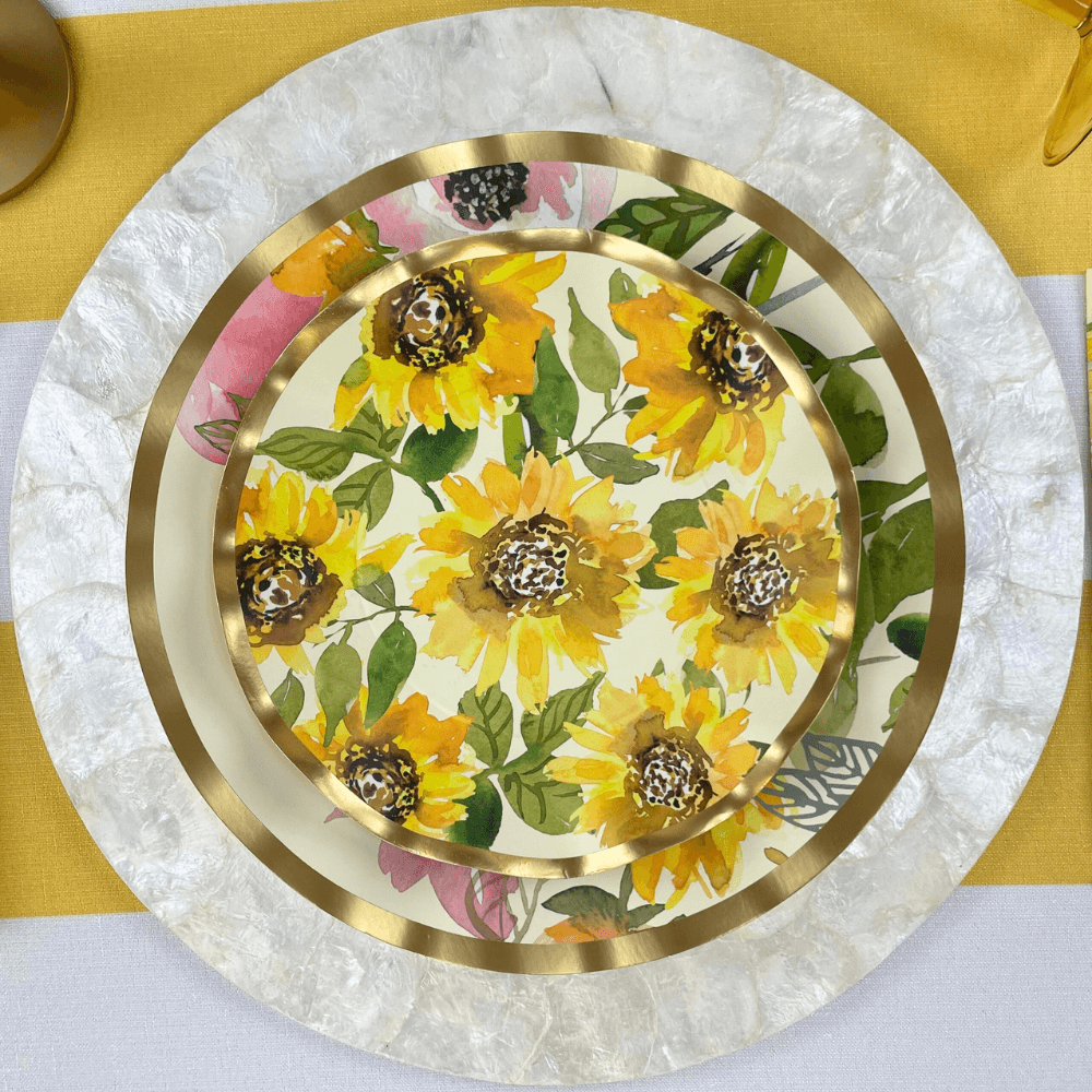 Sunflower Paper Dinner Plate featuring a ruffled foil edge design, showcasing a vibrant sunflower on an off-white background. Adds elegance to events.