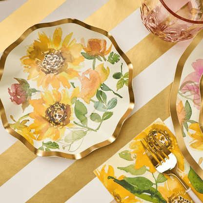 Sunflower Paper Guest Towel Napkins on a table with plates and cutlery, perfect for adding elegance to party dining setups.