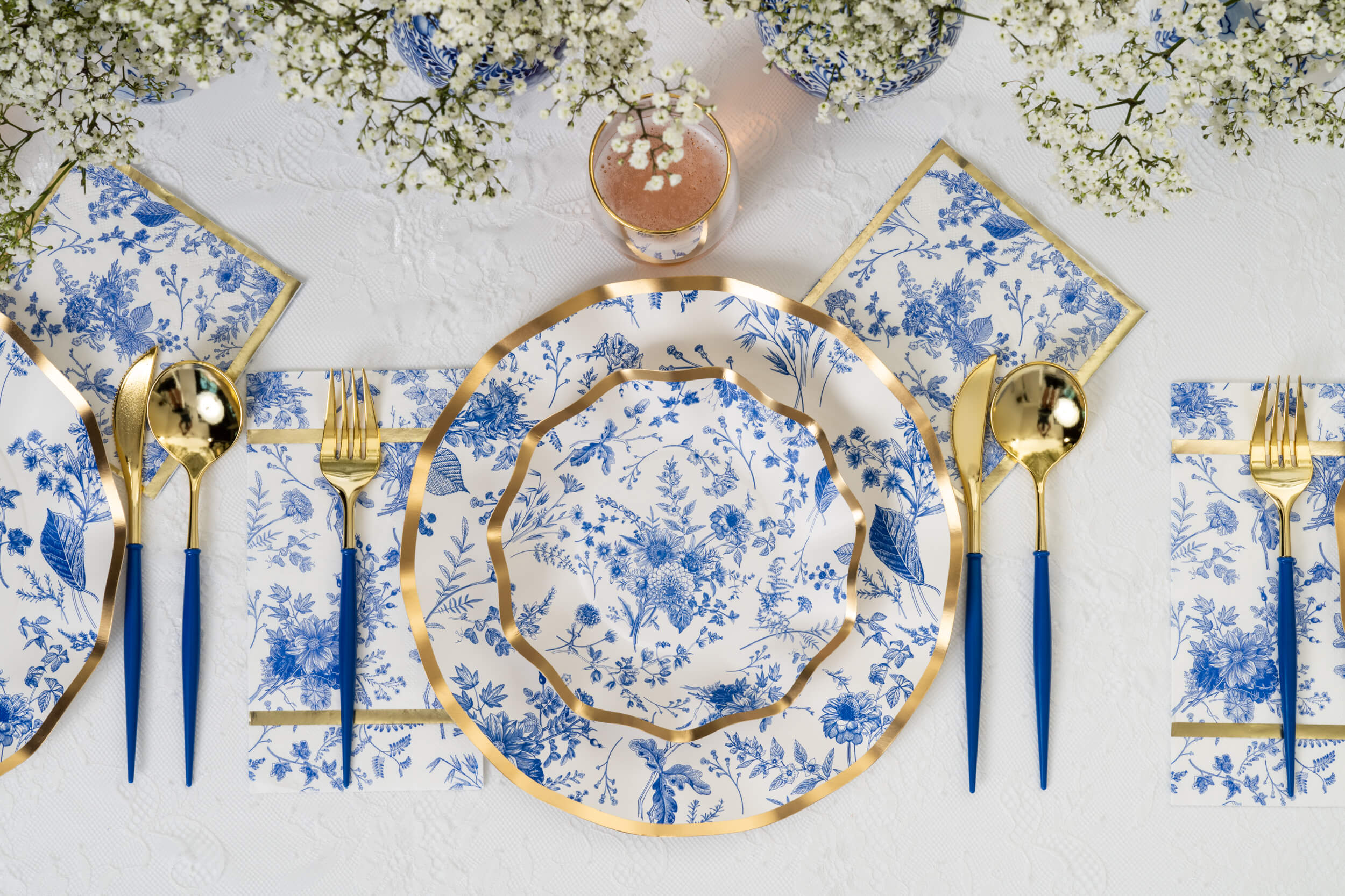 Bella Plastic Cutlery in Gold and Blue, featuring a blue and gold plate, gold spoon and fork, perfect for elevating any event table setting.