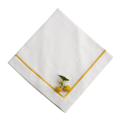 A white linen dinner napkin with yellow trim, perfect for adding elegance to your table setup. 2 per pack.