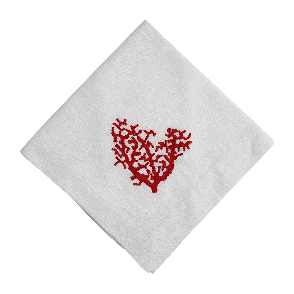 A white linen dinner napkin with a red heart embroidery, perfect for adding elegance to your special table setups.